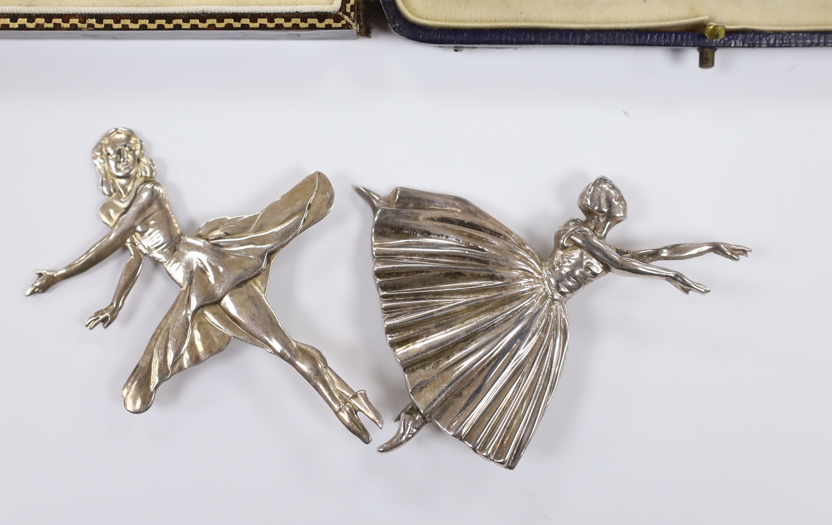 Two silver ballerina brooches, largest 7cm and two cased dress stud set including sterling and mother of pearl.